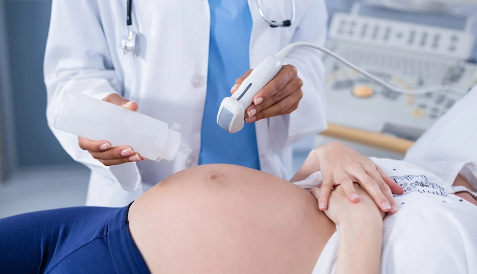 Amniocentesis procedure performed under ultrasound guidance during pregnancy