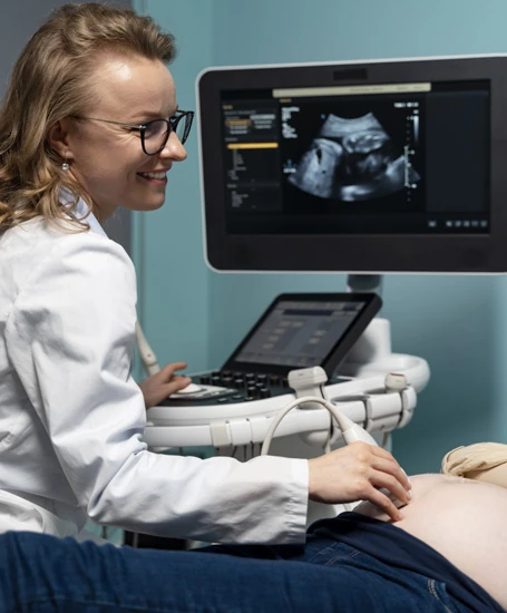 Doctor performing viability scan ultrasound in early pregnancy