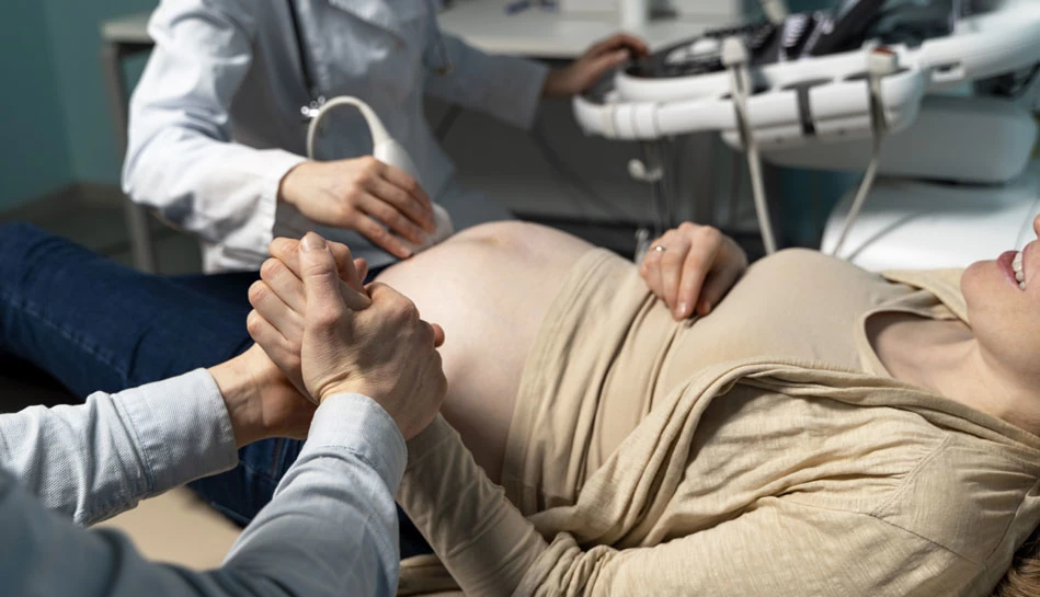 Amniocentesis procedure performed under ultrasound guidance during pregnancy